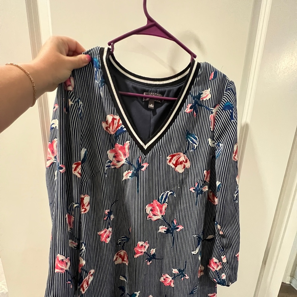 Worn a few times. Size 6 w/Long sleeves. Hits above the knees or at knees